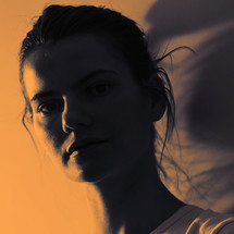 Closeup Profile Of A Woman Silhouette and Sunlight Isolated in Studio