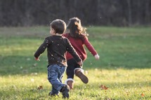 kids running in grass
