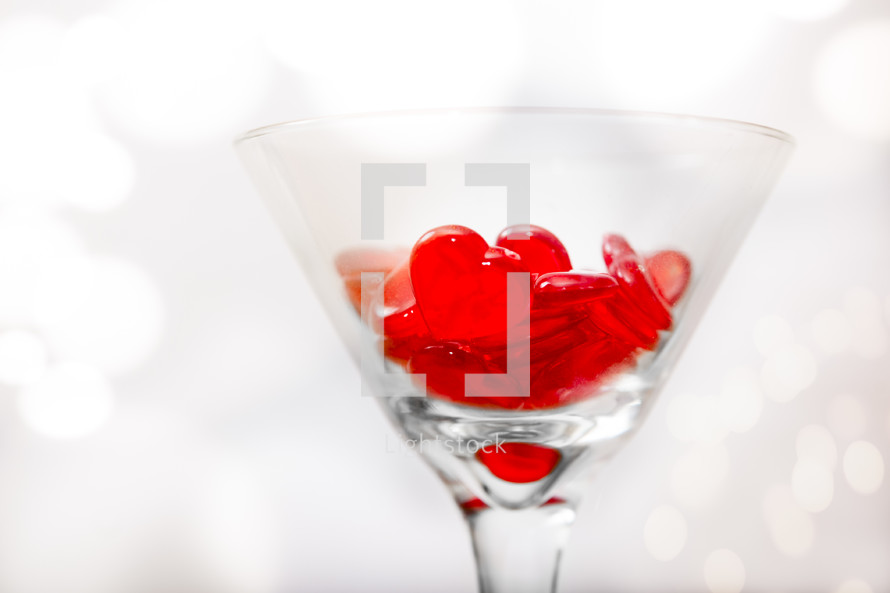 red heart pieces in a cocktail glass 