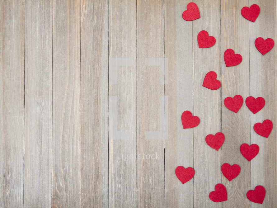 red hearts on weathered wood boards 