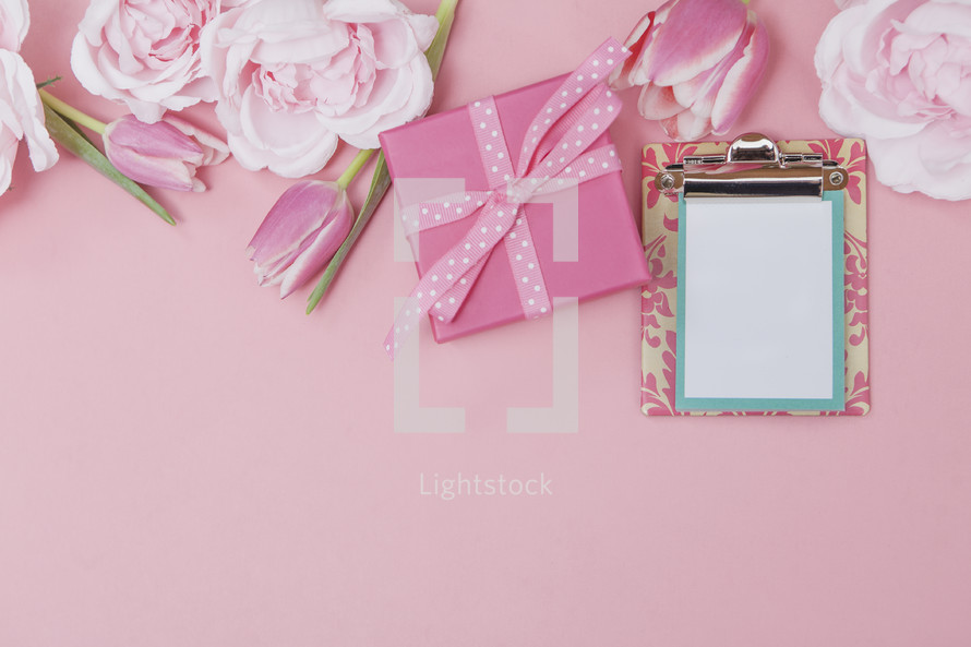 Pink Gift Background with Spring Flowers and Blank Note