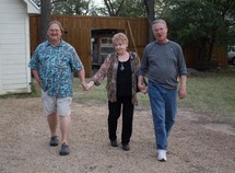 family walking holding hands 