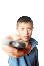 a boy holding a tv remote control 