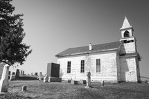 rural church surrounded by a cemetery 