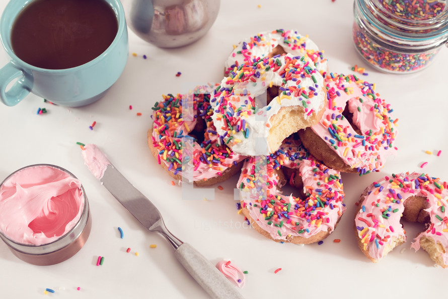 sprinkled donuts with pink icing 