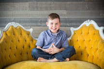 a child sitting on a couch 