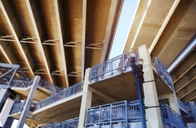 Low angle view of underneath a highway bridge and pedestrian footpath