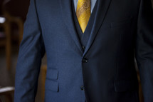 torso of a man in a suit and tie 