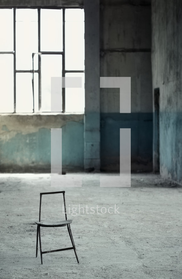 chair in an abandoned building 