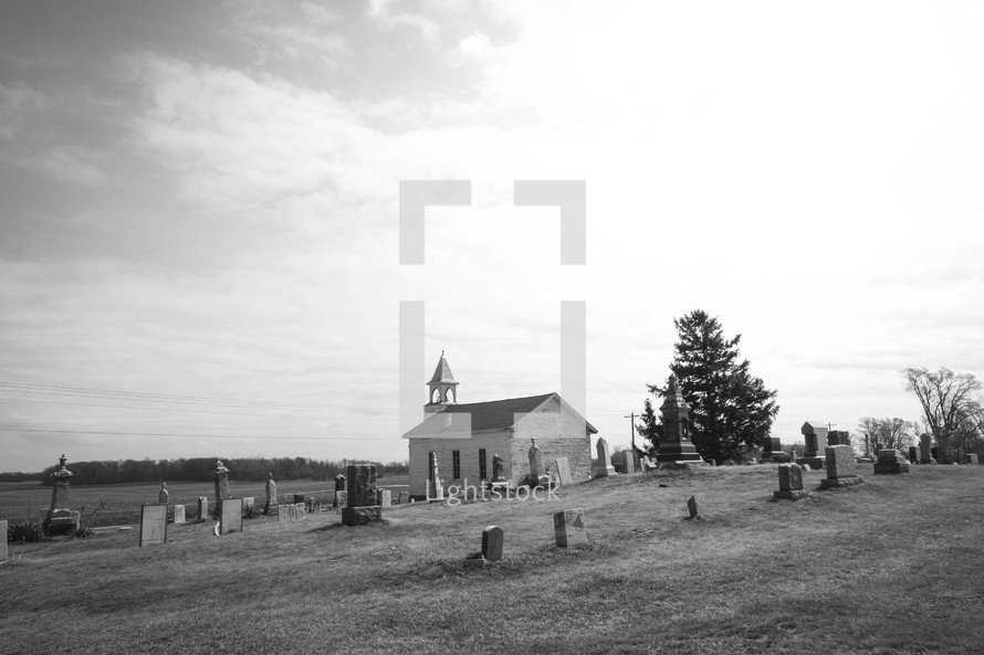 rural church surrounded by a cemetery 