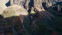 sunlight on rugged cliffs on a mountainous island landscape 