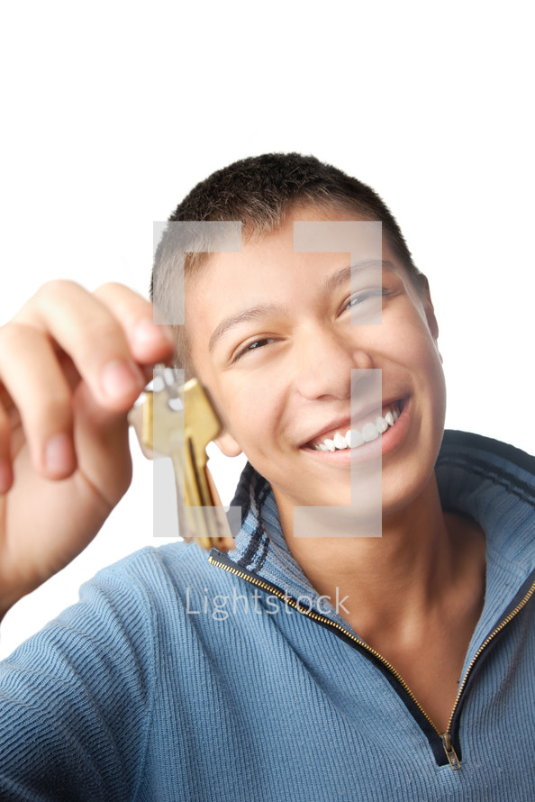 Cheerful male with key from residential apartment