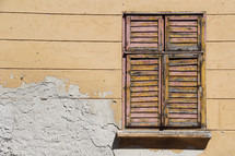 closed shutters on an old window