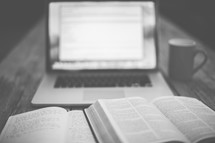 open Bible, journal, computer screen, and coffee mug 