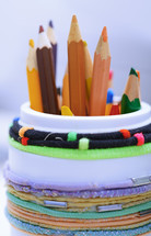colored pencils a container 