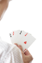 man holding aces 