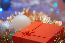 Christmas ornaments and red gift box 