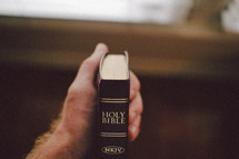 hand gripping a Bible 