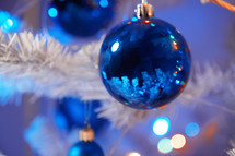 blue ornaments on a Christmas tree
