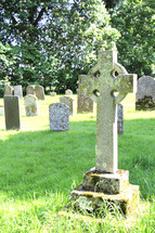 cross tombstones in an old cemetery 