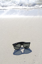 sunglasses on a beach 
