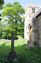 old cemetery in front of a stone church 