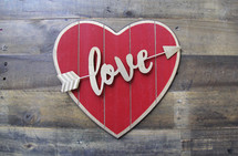 love heart sign on a wood background 