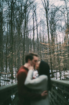 blurry image of a couple kissing 