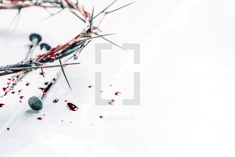 Crown of thorns with blood dripping, nails on stone. Christian concept of Jesus Christ suffering, passion. passion. Good Friday, Easter holiday. Copy space. Crucifixion, resurrection, gospel, salvation