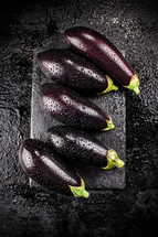 Fresh homemade eggplant on the table. On a wooden background. High quality photo