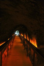 A walkway through an underground tunnel.