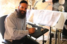 Rabbi hand-writing the Torah 