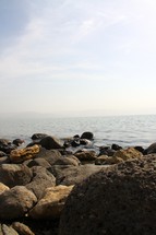 The rocky shore by the Sea of Galilee