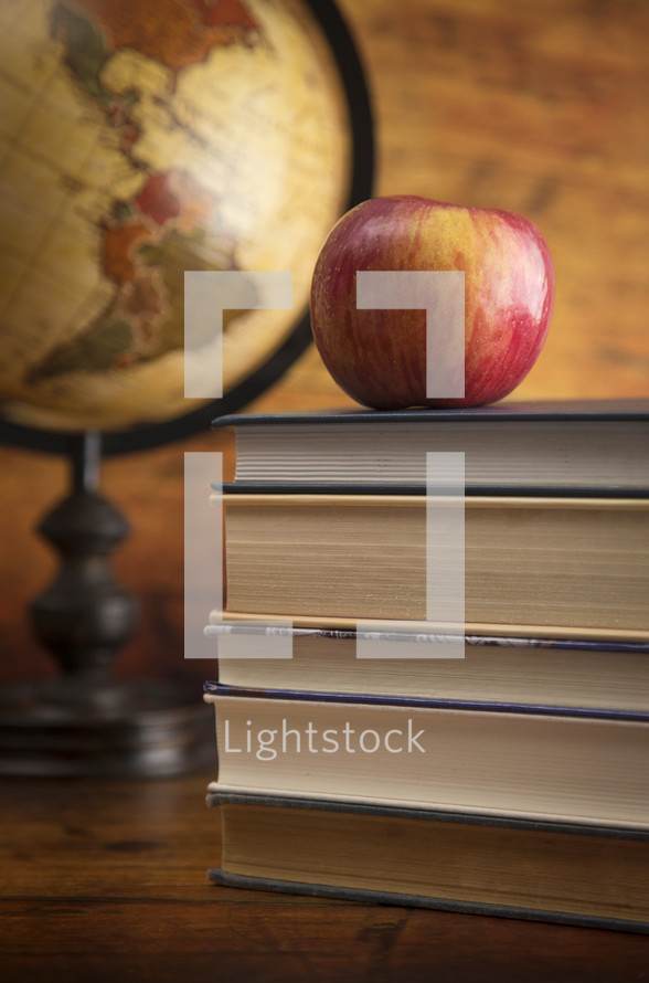 Education Background with a Stack of Books and an Apple