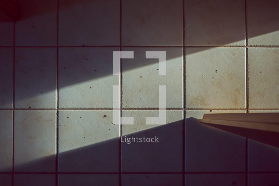 sunlight on a tile floor 