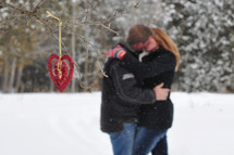 couple kissing in the snow 