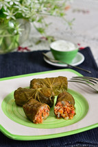 Dolma Rolls Stuffed With Meat, Rice And Vegetables Rolled in Lindens Leaves With Cream