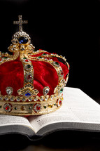 Kings Coronation Crown and a Bible on a Black Background
