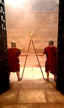 Roman soldiers guarding a gate 