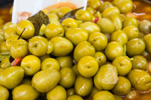 Delicious green big olives on the market