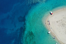 Aerial drone view of iconic small uninhabited island of Marathonisi featuring clear water, sandy shore and natural hatchery of Caretta-Caretta sea turtles, Zakynthos, Greece