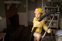 a boy pretending to be a firefighter 