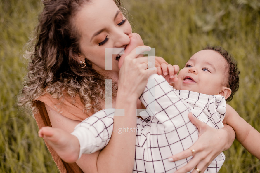 mother and toddler son portrait outdoors 