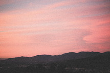 pink sky and mountain silhouette 