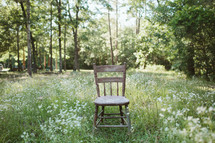 isolated chair in a meadow 