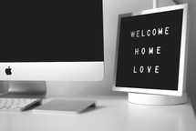 home office with a welcome home sign 