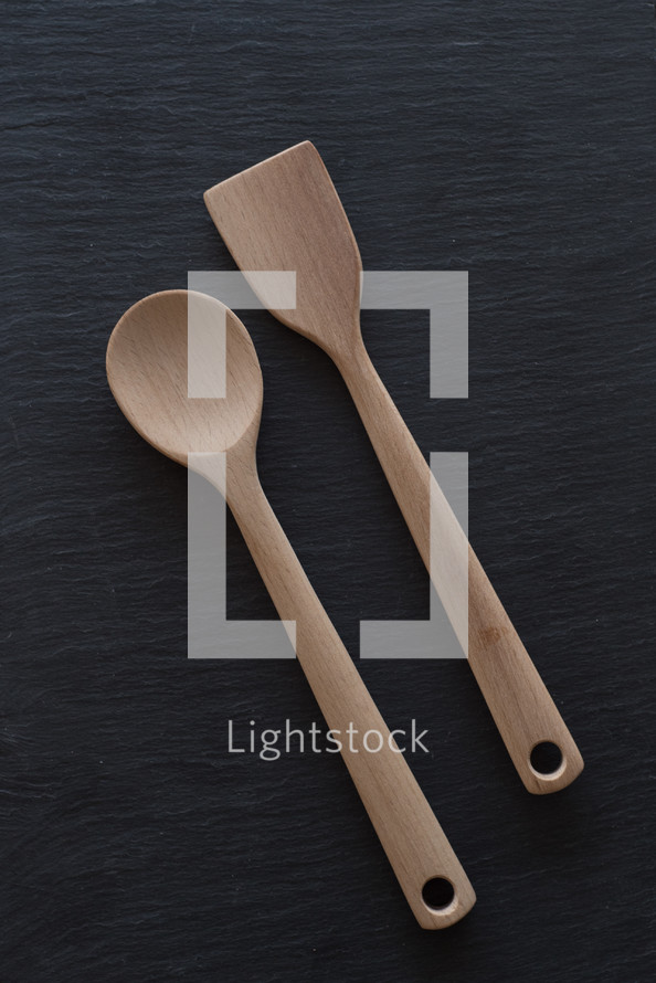 wood spoon on a black background 