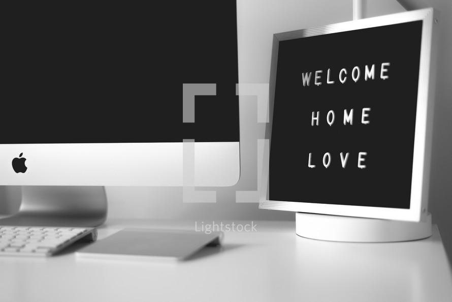 home office with a welcome home sign 