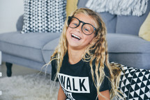 smiling girl in glasses 