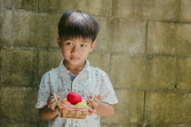 a boy holding an Easter basket 